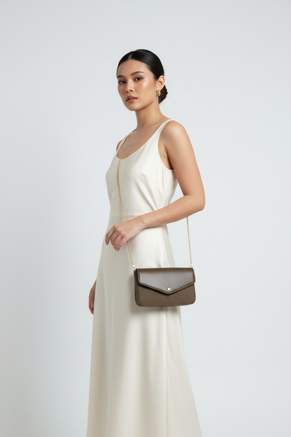 Filipina model wearing olive brown wallet with thin gold chain